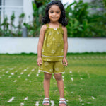 Girl wearing Green cotton pajama set with shorts