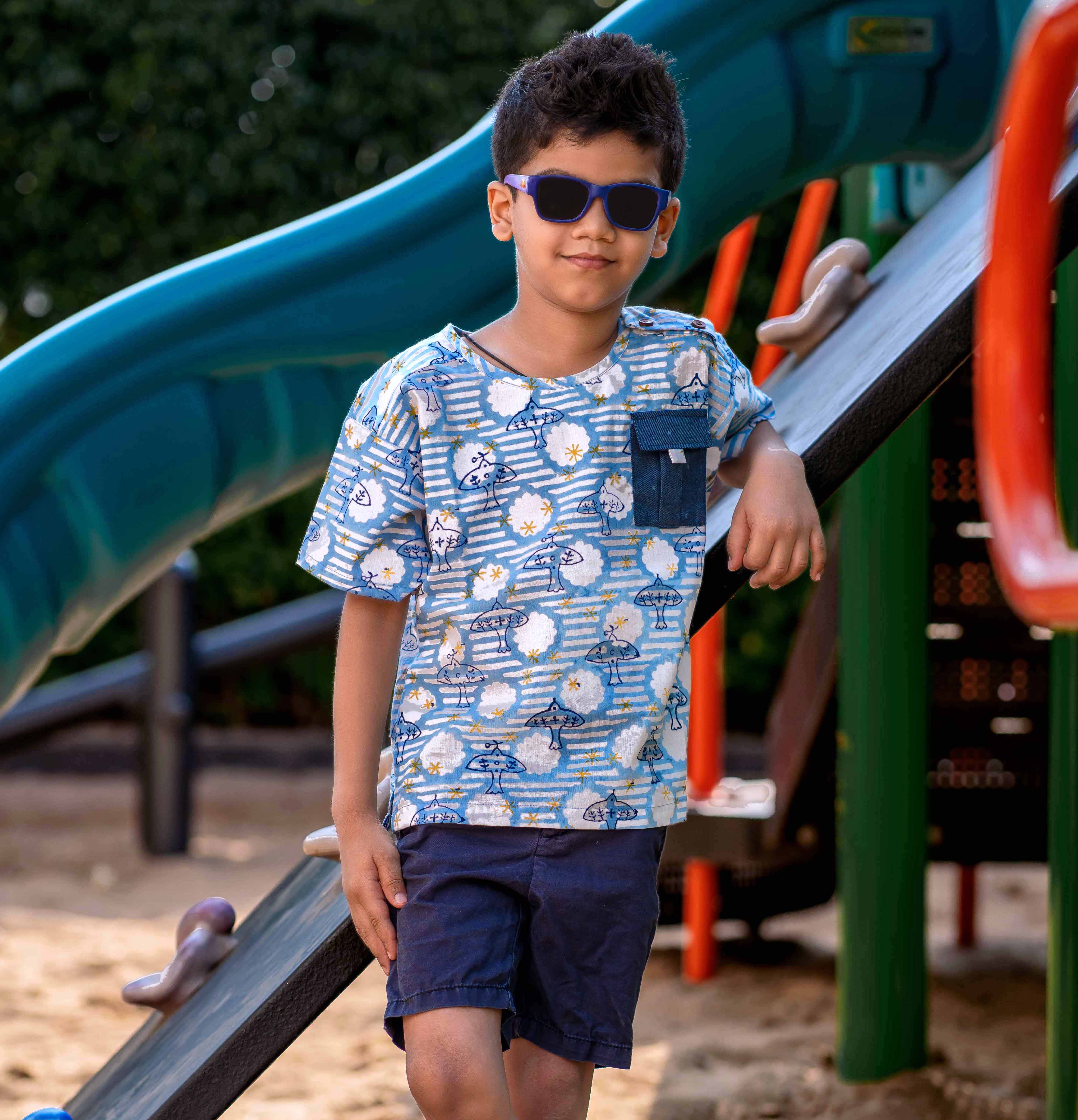 A boy wearing Blue block print cotton shirt with contrast pocket