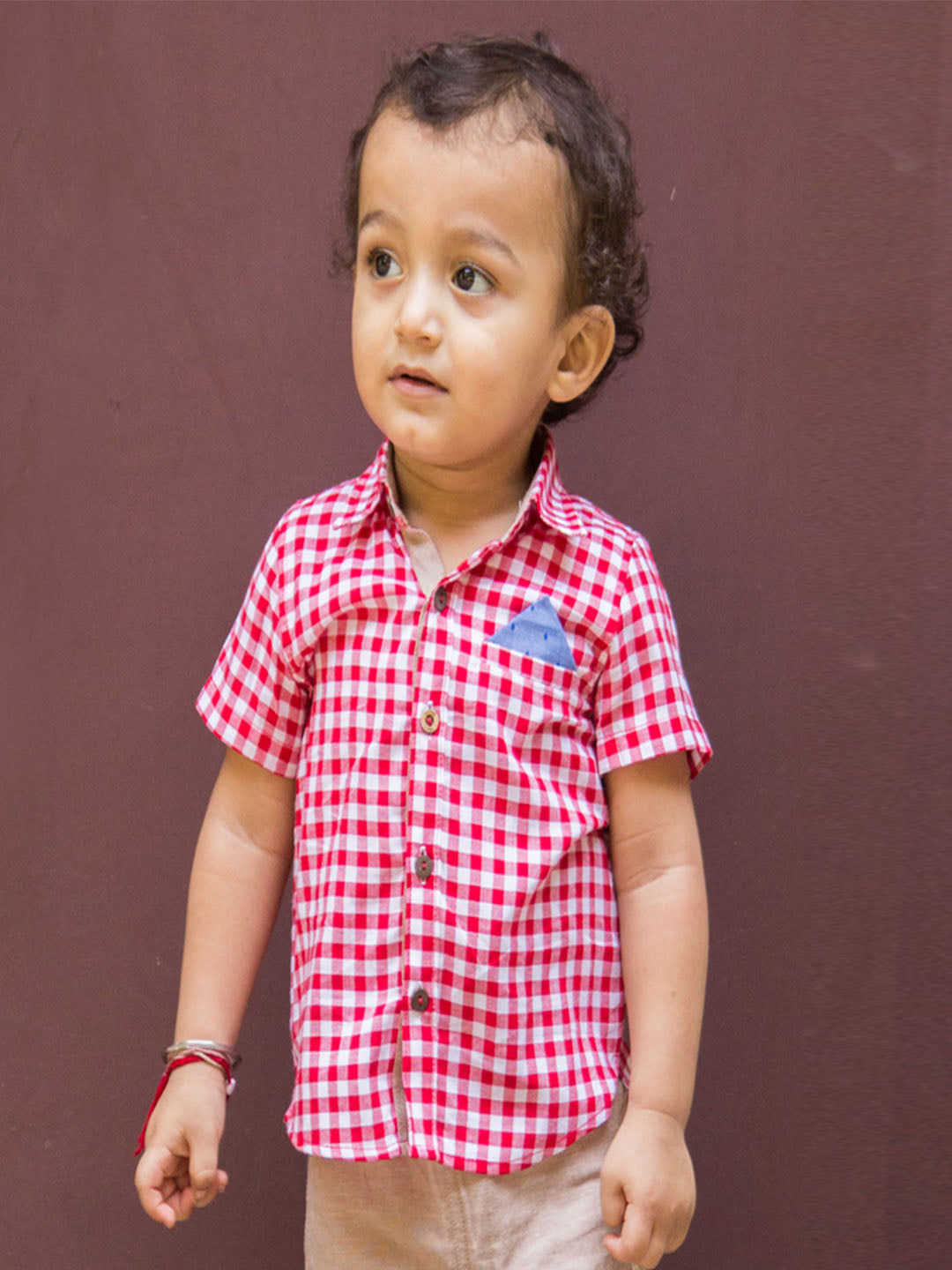 Baby Boy wearing Red Checks Shirt 