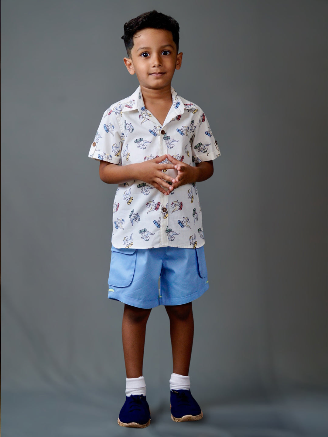 Boy wearing cotton white shirt with Dino print and Blue shorts