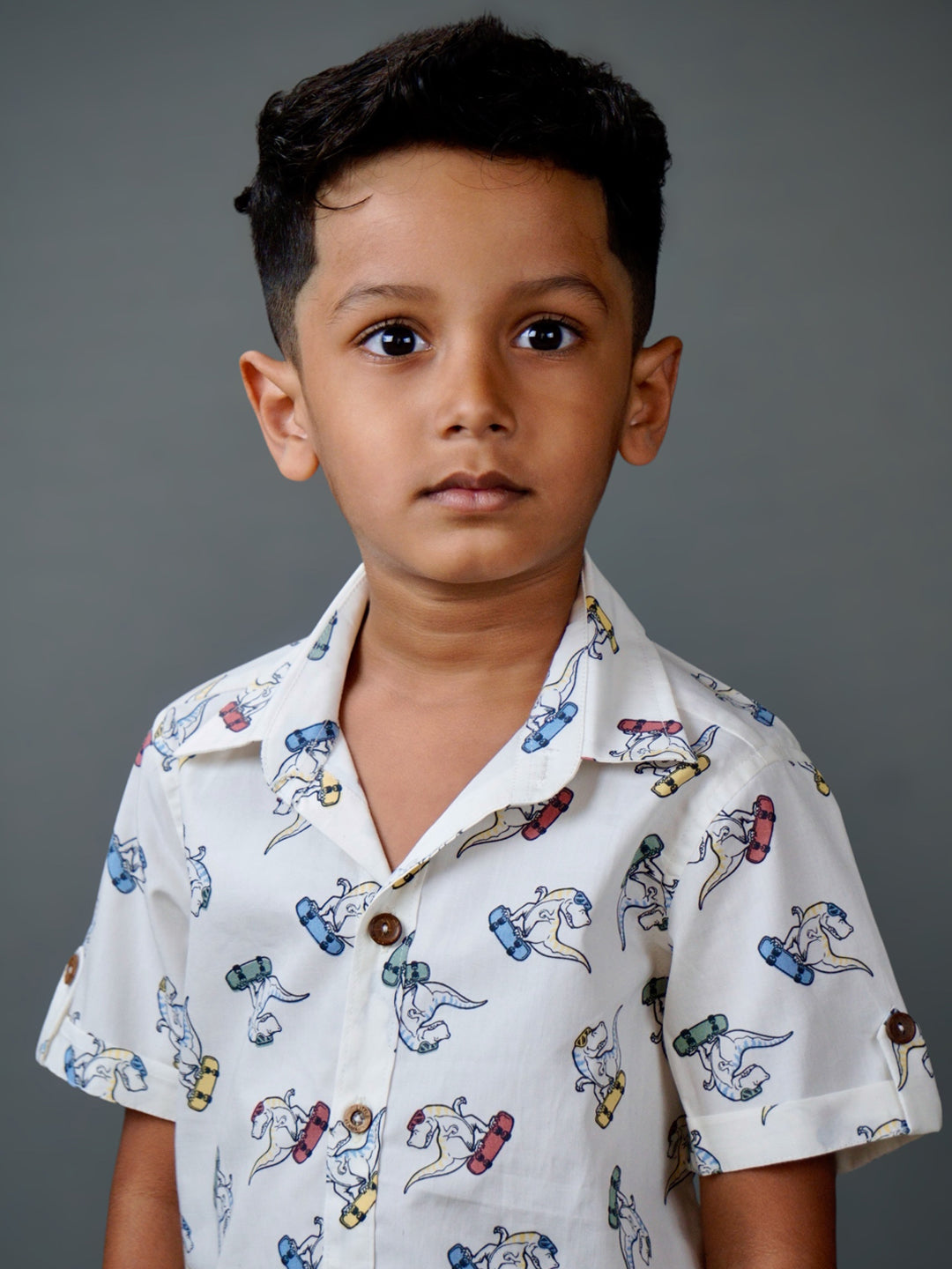 Boy wearing cotton white shirt with Dino print and Blue shorts