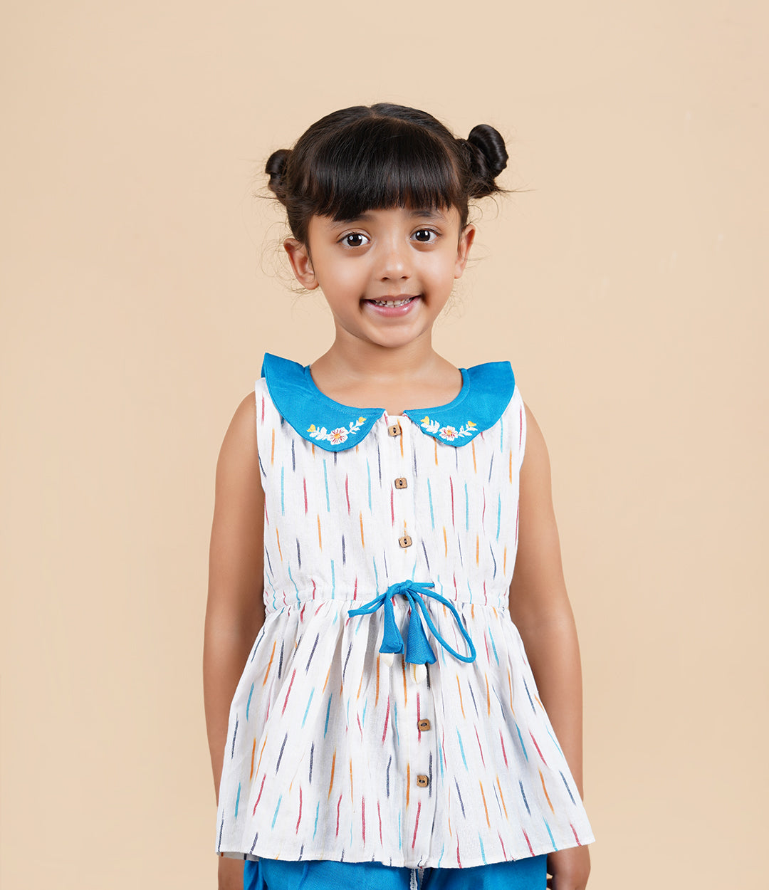 A girl wearing Blue Ikkat Cotton Kurta and Dhoti Pant