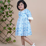 Girl wearing Sea Shells printed blue frock