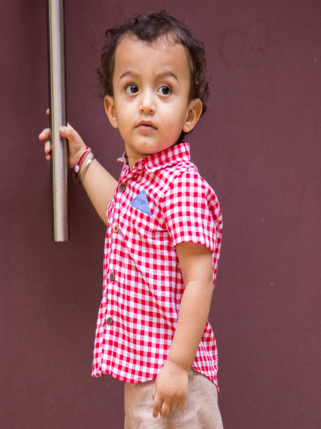 Baby Boy wearing Red Checks Shirt