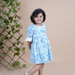 Girl wearing Sea Shells printed blue frock