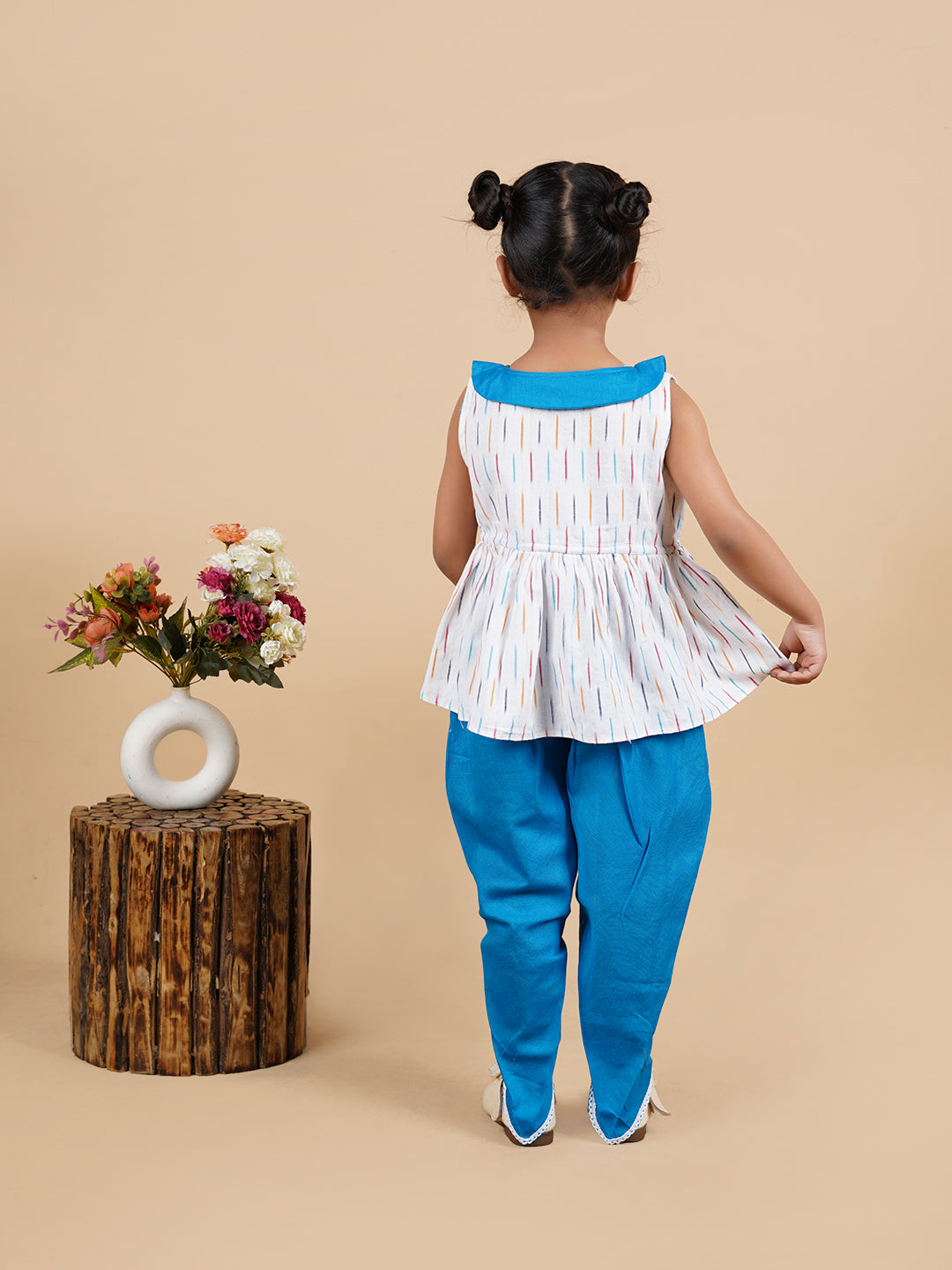 A girl wearing Blue Ikkat Cotton Kurta and Dhoti Pant