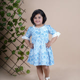 Girl wearing Sea Shells printed blue frock