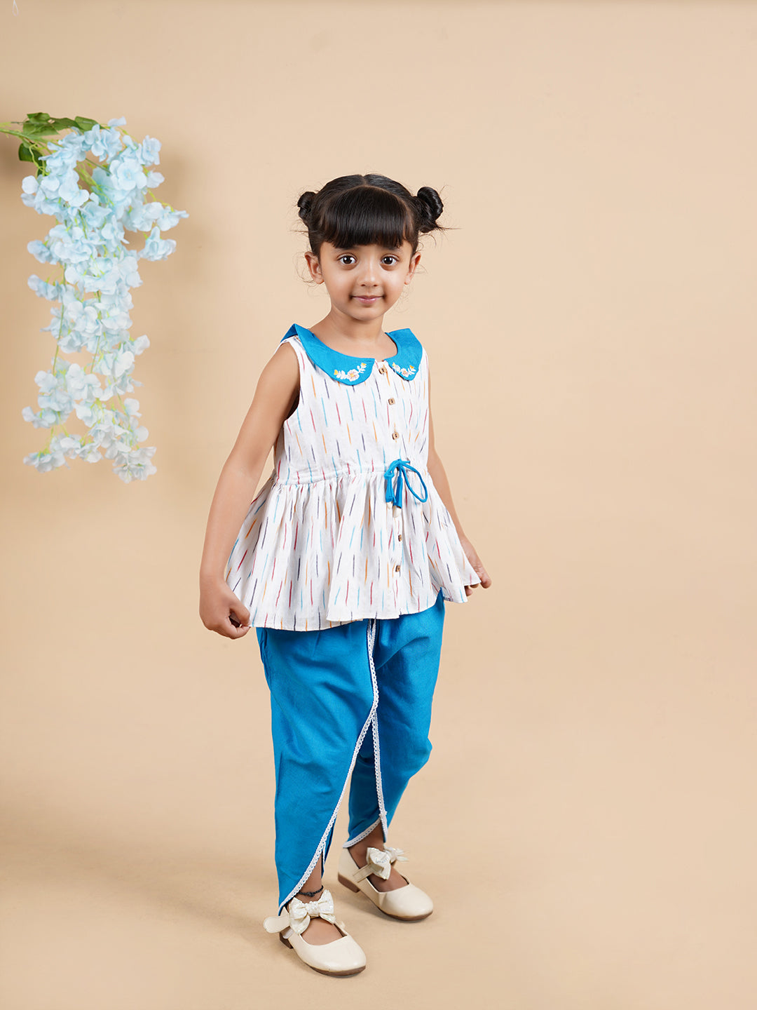 A girl wearing Blue Ikkat Cotton Kurta and Dhoti Pant