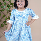 Girl wearing Sea Shells printed blue frock