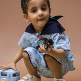 Boy wearing Sharks printed Cotton Coord set which has a hood nd holding a toy in hand