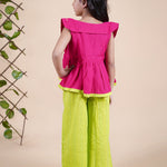 Girl wearing Red top with embroidery and lime green palazzo pants