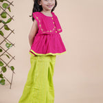 Girl wearing Red top with embroidery and lime green palazzo pants