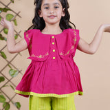 Girl wearing Red top with embroidery and lime green palazzo pants