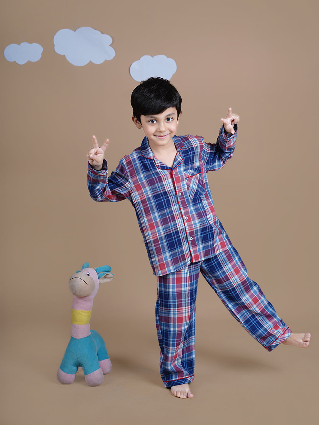 A boy wearing checks cotton night suit 