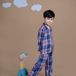 A boy wearing checks cotton night suit 