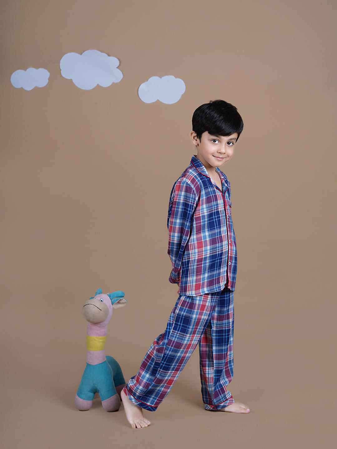 A boy wearing checks cotton night suit 