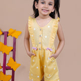 Girl wearing Yellow Jumpsuit with white dots and pink bows