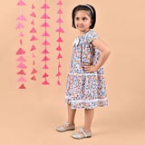 Girl wearing FLoral printed cotton frock that has a bow