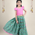 A girl wearing traditional attire in candy pink Cotton top and Green Block print skirt