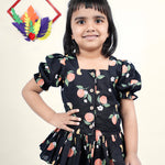 A Girl wearing Black Cotton Top with Peaches printed on it