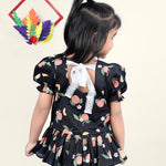 A Girl wearing Black Cotton Top with Peaches printed on it