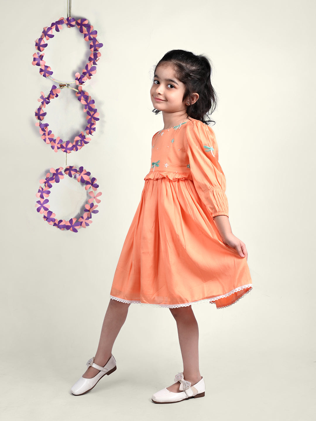 Girl wearing Dragon flies embroidered  orange cotton frock