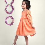 Girl wearing Dragon flies embroidered  orange cotton frock