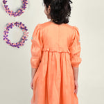 Girl wearing Dragon flies embroidered  orange cotton frock