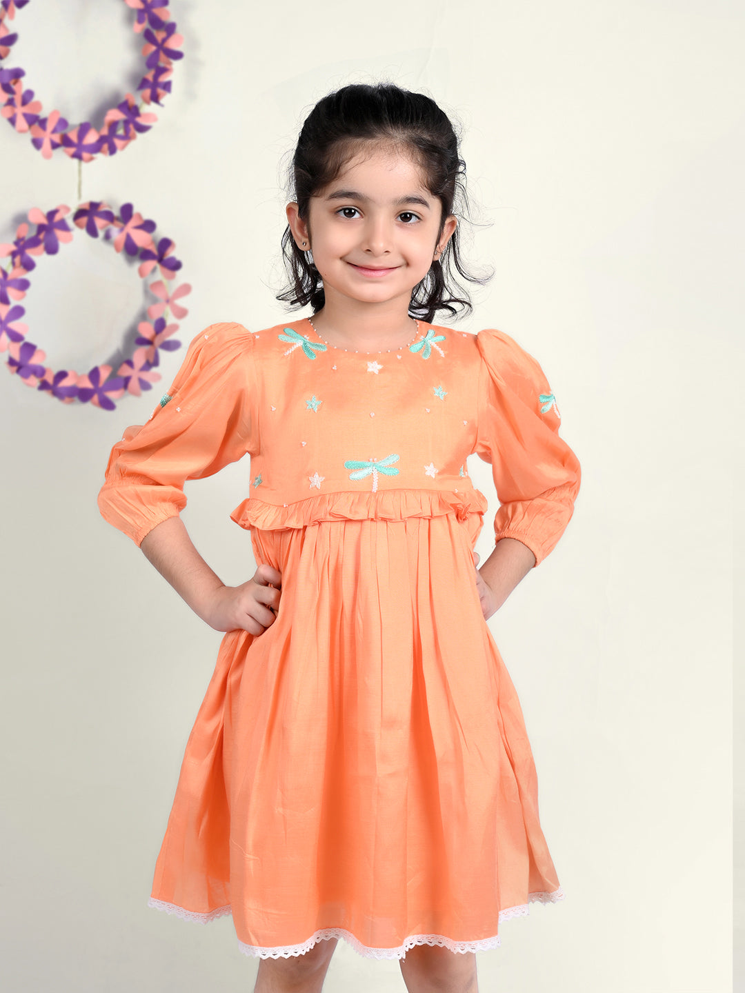 Girl wearing Dragon flies embroidered  orange cotton frock