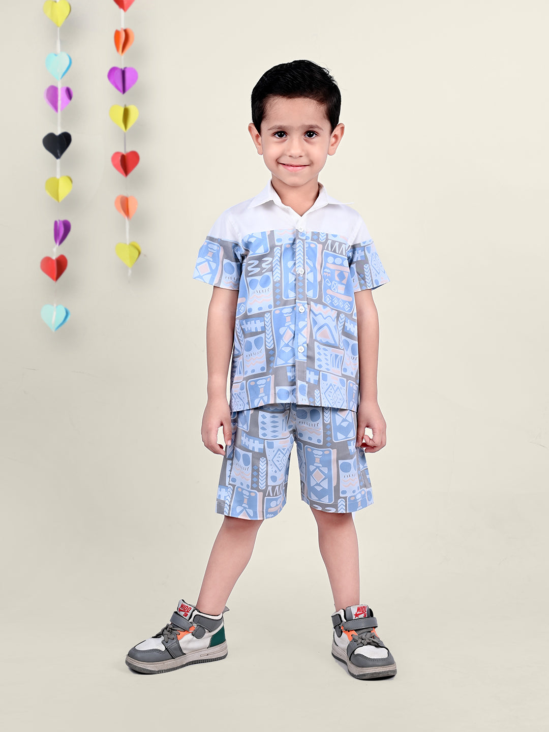 A boy wearing Blue and White Printed coord set