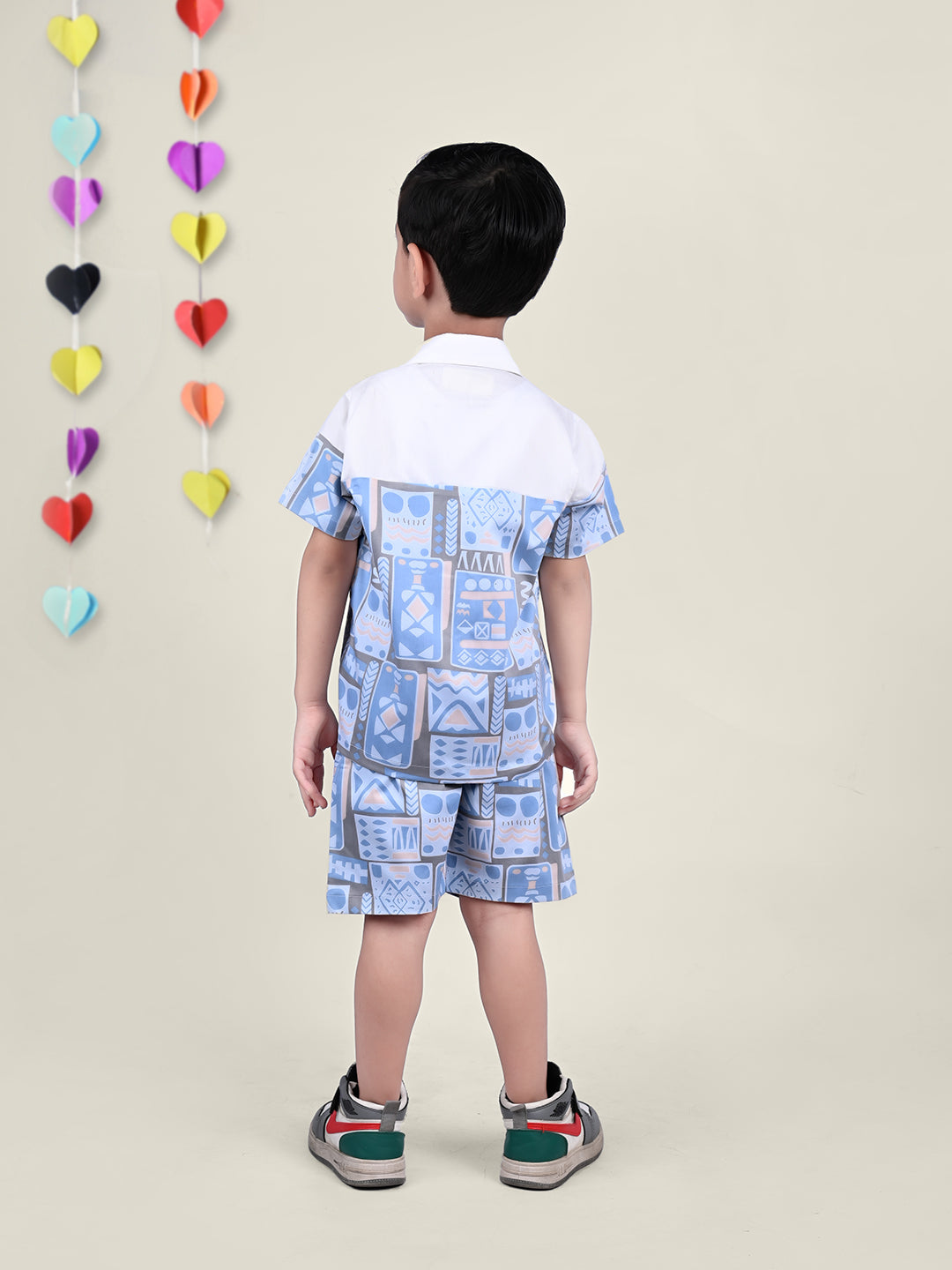 A boy wearing Blue and White Printed coord set