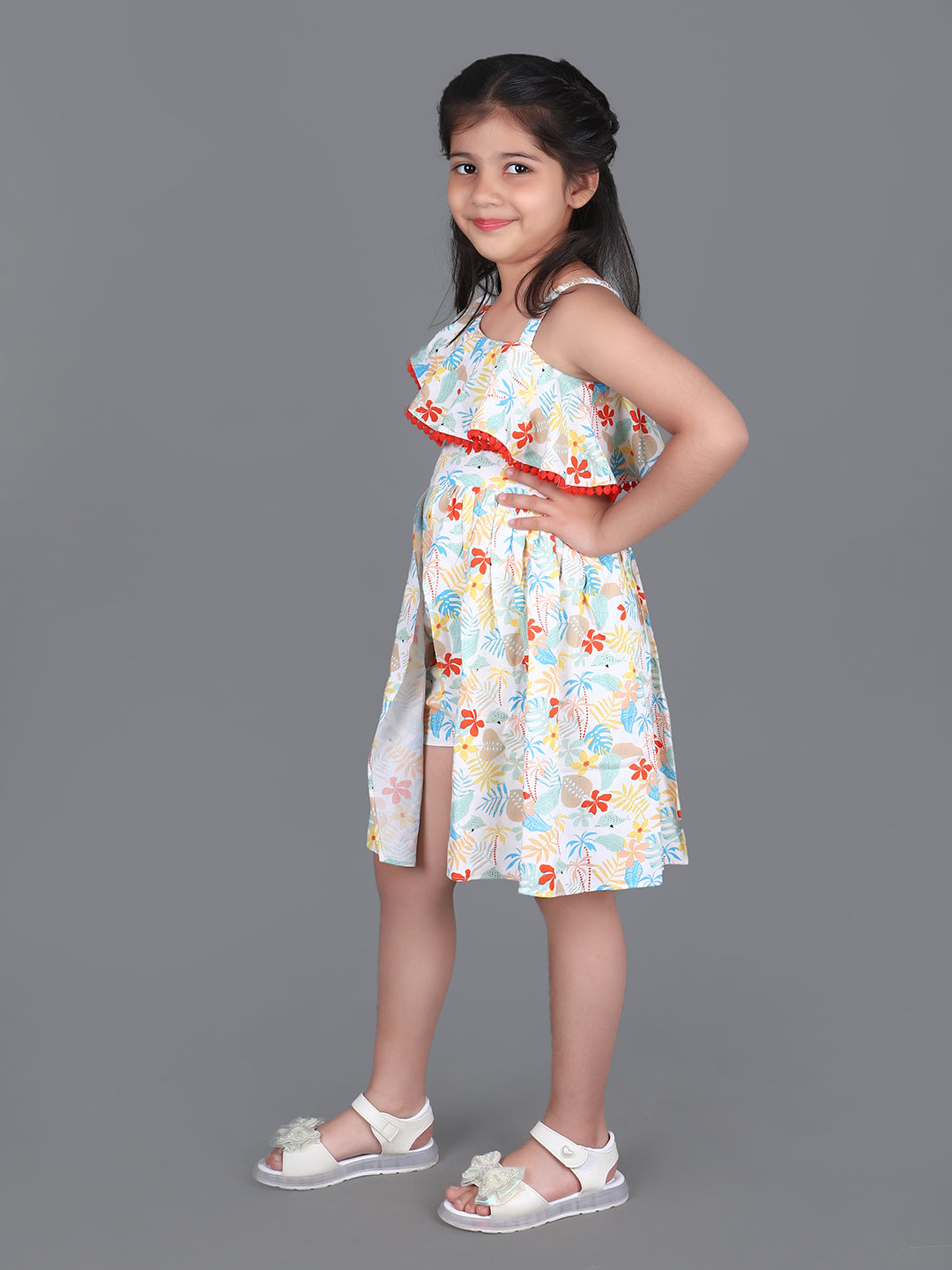 Girl wearing floral printed cotton frock jumpsuit