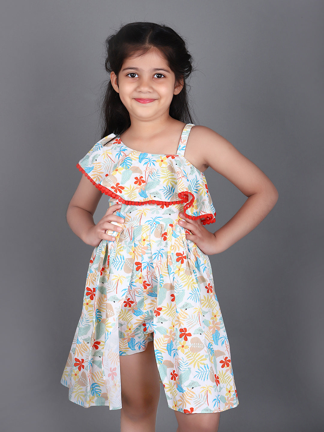 Girl wearing floral printed cotton frock jumpsuit