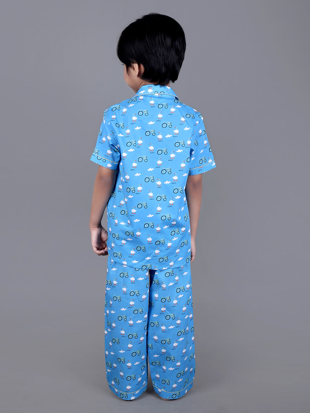 Boy wearing Blue Cotton night suit with ducks printed on it