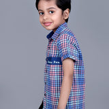 Boy wearing Blue Checks shirt with endless fun written on it