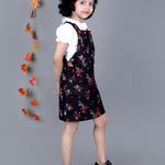 Smiling girl wearing Black floral Cotton Dungree with White Top inside