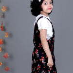 Smiling girl wearing Black floral Cotton Dungree with White Top inside