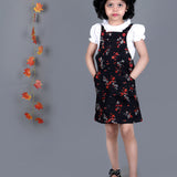 Girl wearing Black floral Cotton Dungree with White Top inside