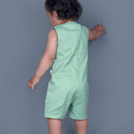 Baby boy wearing Dino printed green romper with a cute tail popping out