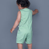 Baby boy wearing Dino printed green romper with a cute tail popping out