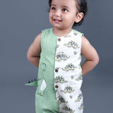 Baby boy wearing Dino printed green romper with a cute tail popping out