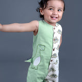 Baby boy wearing Dino printed green romper with a cute tail popping out