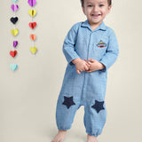 Smiling Baby Boy wearing blue cotton romper with stars on it