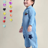 Smiling Baby Boy wearing blue cotton romper with stars on it