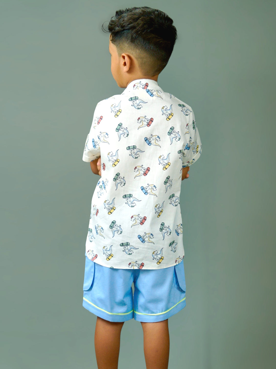 Boy wearing cotton white shirt with Dino print and Blue shorts