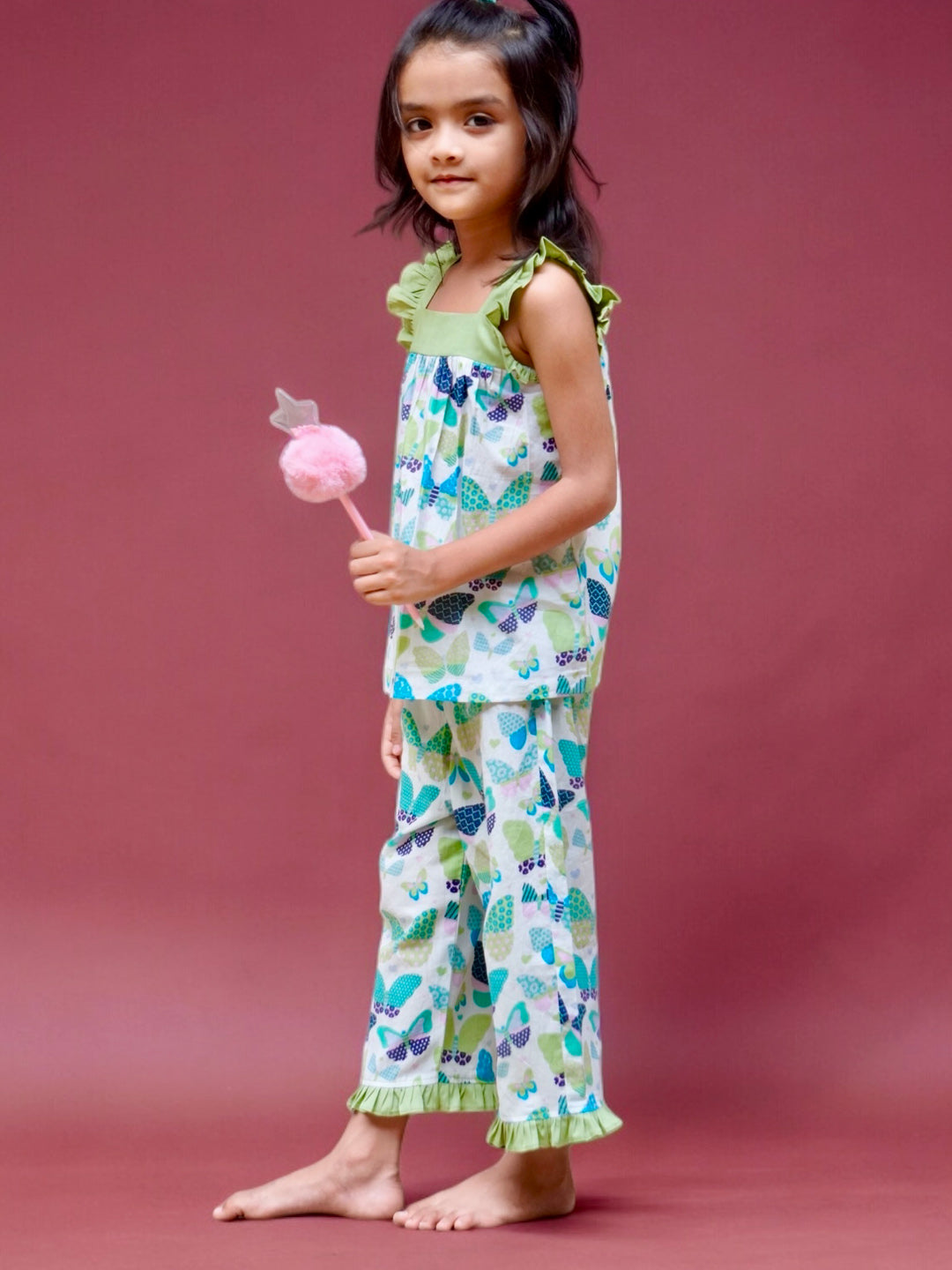 A girl wearing butterfly printed cotton suit with capri