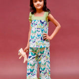 A girl wearing butterfly printed cotton suit with capri