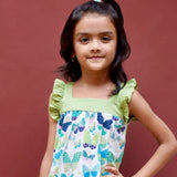 A girl wearing butterfly printed cotton suit with capri