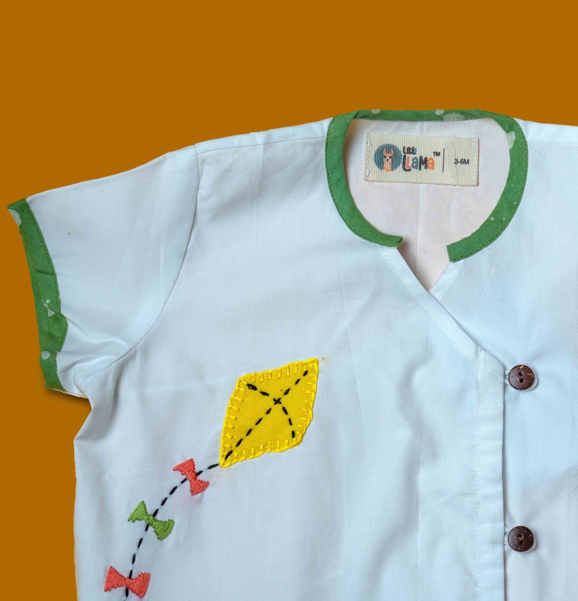 Baby Boy wearing Cotton Angrakha Kurta with kite embroidery and green pants