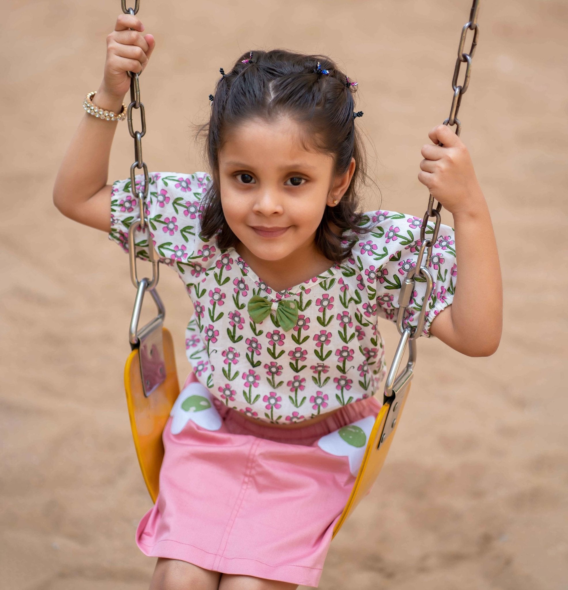 A girl wearing Block print cotton crop top and peach skirt with flowers